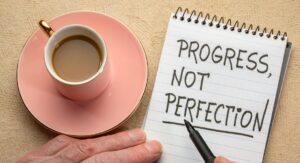 Przeczenia po angielsku - wpis na bloga. "Progress not perfection" - zastosowanie przeczenia.